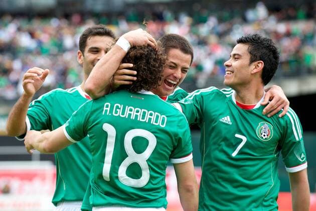 Mar. 26, 2011 - Oakland, California, U.S - Mexico defender Rafael Marquez (4), forward Javier Hernandez (14), and forward Pablo Barrera (7) congratulate midfielder Andres Guardado (18) after Guardado s first-half goal during the FIFA friendly match between Mexico and Paraguay at Oakland-Alameda County Coliseum in Oakland, CA. Mexico beat Paraguay 3-1. - ZUMAq48 o0 Chicharito