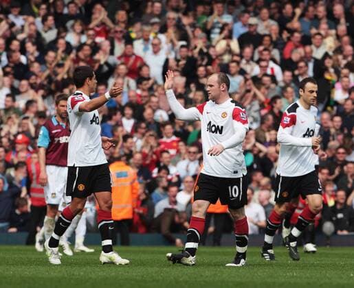 Wayne Rooney (C) of Manchester United after scoring his first goal - Barclays Premier League, London, West Ham United v Manchester United 2nd April, 2011 EDITORIAL USE ONLY. No use with unauthorised audio, video, data, fixture lists, club league logos or live services. Online in-match use limited to 120 images, no video emulation. No use in betting, games or single club league player publications. o0 Manu Jubel Freude