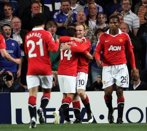 Manchester Uniteds Wayne Rooney (2.R) celebrates scoring his sides opening goal with Luis Antonio Valencia (R) - UEFA Champions League quarter final 1st leg Chelsea FC London vs. Manchester United 6th April, 2011 EDITORIAL USE ONLY. No use with unauthorised audio, video, data, fixture lists, club league logos or live services. Online in-match use limited to 120 images, no video emulation. No use in betting, games or single club league player publications.