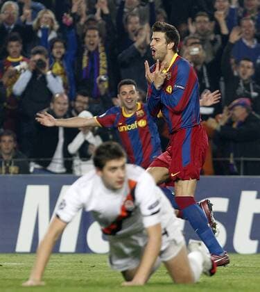 FC Barcelona s Gerard Pique (r) and Xavi Hernandez celebrates goal - UEFA Champions League - FC Barcelona (Barca) - Shakhtar Donetsk -  (20120563)