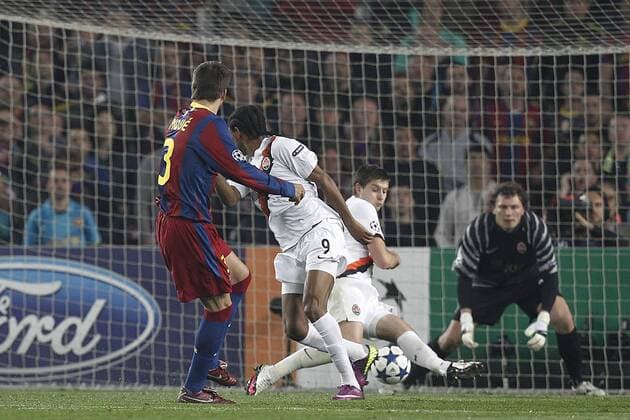 Barcelona s Gerard Pique (L) scores - UEFA Champions League - FC Barcelona (Barca) - Shakhtar Donetsk -  (20120578)