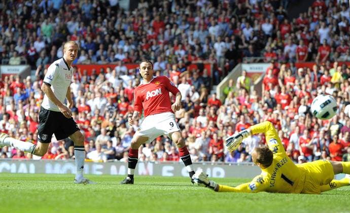 Dimitar Berbatov of Manchester United (Manu) scores past Mark Schwarzer of Fulham - Premier League - Manchester United (Manu) v FC Fulham (white) - 9th April, 2011 - EDITORIAL USE ONLY. No use with unauthorised audio, video, data, fixture lists, club league logos or live services. Online in-match use limited to 120 images, no video emulation. No use in betting, games or single club league player publications.