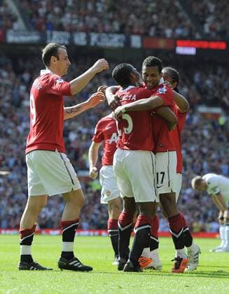 Luis Antonio Valencia (C) of Manchester United (Manu) celebrates with Nani and Dimitar Berbatov (L) of Manchester United (Manu) - Premier League - Manchester United (Manu) v FC Fulham (white) - 9th April, 2011 - EDITORIAL USE ONLY. No use with unauthorised audio, video, data, fixture lists, club league logos or live services. Online in-match use limited to 120 images, no video emulation. No use in betting, games or single club league player publications.