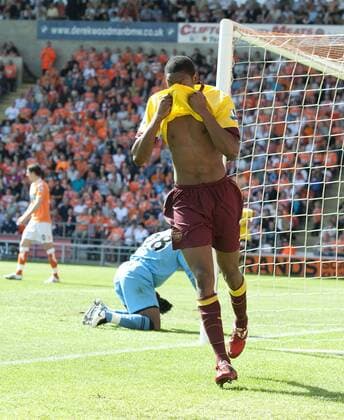 Abou Diaby of FC Arsenal London (yellow) celebrates scoring the first goal --- Barclays Premier League - Blackpool FC (orange) vs FC Arsenal London (yellow) 10th April, 2011 EDITORIAL USE ONLY. No use with unauthorised audio, video, data, fixture lists, club league logos or live services. Online in-match use limited to 120 images, no video emulation. No use in betting, games or single club league player publications. o0 Jubel Freude