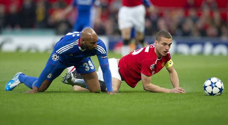 Nicolas Anelka of Chelsea FC (blue) challenges Nemanja Vidic of Manchester United (Manu) - Champions League - Manchester United (Manu) v Chelsea FC (blue) 12th April, 2011 - EDITORIAL USE ONLY. No use with unauthorised audio, video, data, fixture lists, club league logos or live services. Online in-match use limited to 120 images, no video emulation. No use in betting, games or single club league player publications.
