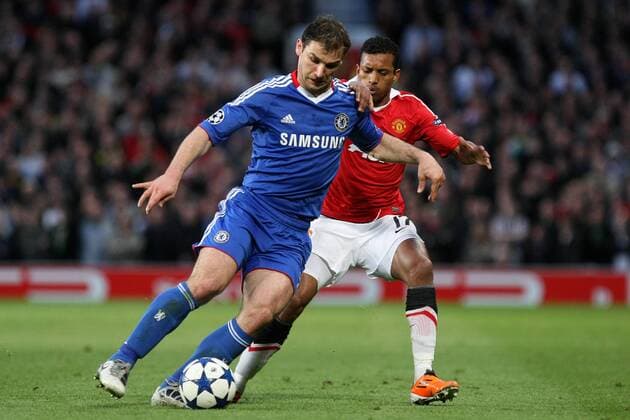Manchester United (red) - Chelsea FC London (blue), Branislav Ivanovic of Chelsea and Nani of Manchester United jostle for the ball at Old Trafford 