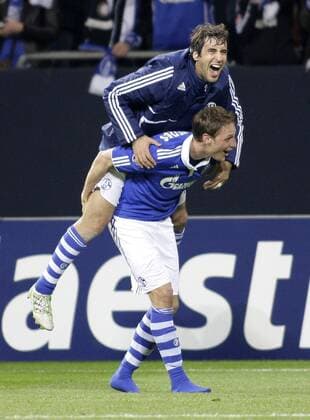 Schalke s RAUL and Schalke s Benedikt HÖWEDES celebrate the victory during the quarterfinal of the Champions League match between FC Schalke 04 and Inter Mailand, Veltinsarena in Gelsenkirchen on April 13., 2011. Mika