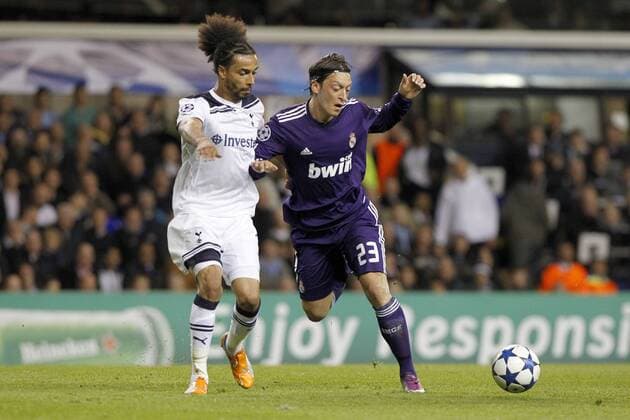 Football - Champions League Quarter Final Second Leg - Tottenham Hotspur (white) vs Real Madrid (blue) --- Real Madrid s Mesut Özil and Tottenham Hotspur s Benoit Assou-Ekotto in action at White Hart Lane 