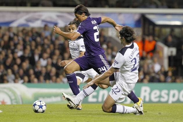 Football - Champions League Quarter Final Second Leg - Tottenham Hotspur (white) vs Real Madrid (blue) --- Real Madrid s Sami Khedira attempts to go past Tottenham Hotspur s Vedran Corluka at White Hart Lane 