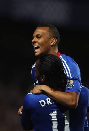 Ryan Bertrand of Chelsea jumps on Didier Drogba after setting up Florent Malouda of Chelsea to score his second goal Barclays Premier League Chelsea v Birmingham City 20th April, 2011 EDITORIAL USE ONLY. No use with unauthorised audio, video, data, fixture lists, club league logos or live services. Online in-match use limited to 120 images, no video emulation. No use in betting, games or single club league player publications.