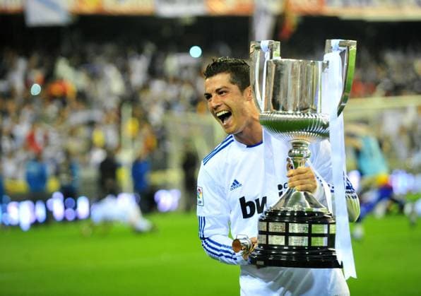 -- VALENCIA, April 20, 2011 -- Real Madrid s Cristiano Ronaldo jubilates with the trophy after winning the King s Cup final soccer match against Barcelona at Mestalla stadium in Valencia, Spain, April 20, 2011. Real Madrid claimed the champion by defeating FC Barcelona Barca 1-0. 
