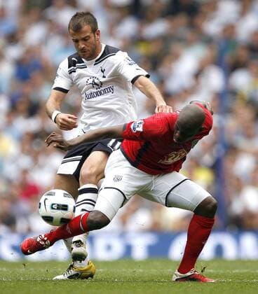 Youssuf Mulumbu (R) of West Bromwich Albion holds off Rafael van der Vaart of Tottenham Hotspur Barclays Premier League, Tottenham Hotspur v West Bromwich Albion 23rd April, 2011 EDITORIAL USE ONLY. No use with unauthorised audio, video, data, fixture lists, club league logos or live services. Online in-match use limited to 120 images, no video emulation. No use in betting, games or single club league player publications.