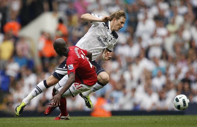 Roman Pavlyuchenko (R) of Tottenham Hotspur gets past Youssuf Mulumbu of West Bromwich Albion Barclays Premier League Tottenham Hotspur v West Bromwich Albion 23rd April, 2011 EDITORIAL USE ONLY. No use with unauthorised audio, video, data, fixture lists, club league logos or live services. Online in-match use limited to 120 images, no video emulation. No use in betting, games or single club league player publications.