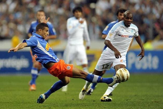 Finale des Coupe de la Ligue - Olympique Marseille (weiß) vs. Montpellier HSC (blau) --- Jamel SAIHI (Montpellier) - Charles KABORE (Marseille) -  AnthonyBibardFEP