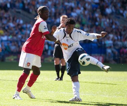 Daniel Sturridge (R) of Bolton Wanderers fires in a shot past Bacary Sagna of Arsenal Barclays Premier League; Bolton Wanderers vs Arsenal FC London 24th April, 2011 EDITORIAL USE ONLY. No use with unauthorised audio, video, data, fixture lists, club league logos or live services. Online in-match use limited to 120 images, no video emulation. No use in betting, games or single club league player publications.