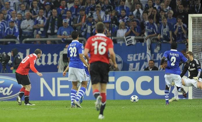 Wayne Rooney (L) of Manchester United scores the second goal - Champions League SemiFinal 1st leg - FC Schalke 04 (blue) vs Manchester United (ManU) - EDITORIAL USE ONLY. No use with unauthorised audio, video, data, fixture lists, club league logos or live services. Online in-match use limited to 120 images, no video emulation. No use in betting, games or single club league player publications.
