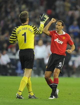 Edwin van der Sar of Manchester United celebrates with Rio Ferdinand of Manchester United following the second goal - Champions League SemiFinal 1st leg - FC Schalke 04 (blue) vs Manchester United (ManU) - EDITORIAL USE ONLY. No use with unauthorised audio, video, data, fixture lists, club league logos or live services. Online in-match use limited to 120 images, no video emulation. No use in betting, games or single club league player publications.