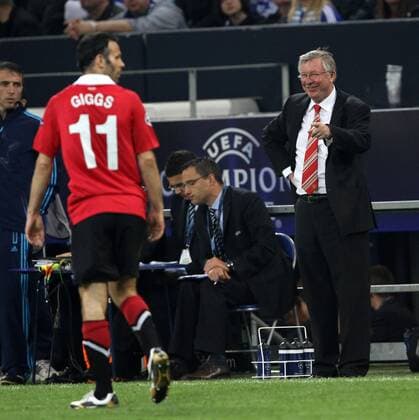 Manchester United s coach Sir Alex Ferguson smiles at Ryan Giggs - Champions League SemiFinal 1st leg - FC Schalke 04 (blue) vs Manchester United (ManU) - EDITORIAL USE ONLY. No use with unauthorised audio, video, data, fixture lists, club league logos or live services. Online in-match use limited to 120 images, no video emulation. No use in betting, games or single club league player publications.
