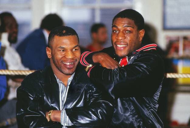 Frank Bruno (GBR, R) and Mike Tyson (USA) meet at Bruno s training camp - 