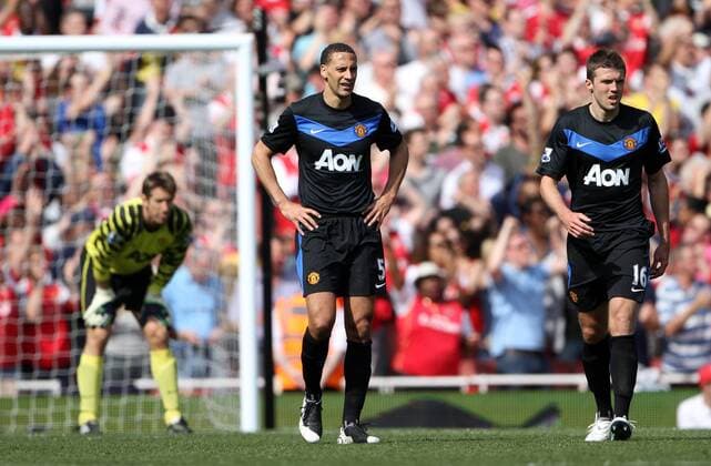 Manchester Uniteds Rio Ferdinand (L) and Michael Carrick look on dejected after going 1-0 down Barclays Premier League, London, Arsenal FC (red) v Manchester United (black) 1st May, 2011 EDITORIAL USE ONLY. No use with unauthorised audio, video, data, fixture lists, club league logos or live services. Online in-match use limited to 120 images, no video emulation. No use in betting, games or single club league player publications. o0 Manu