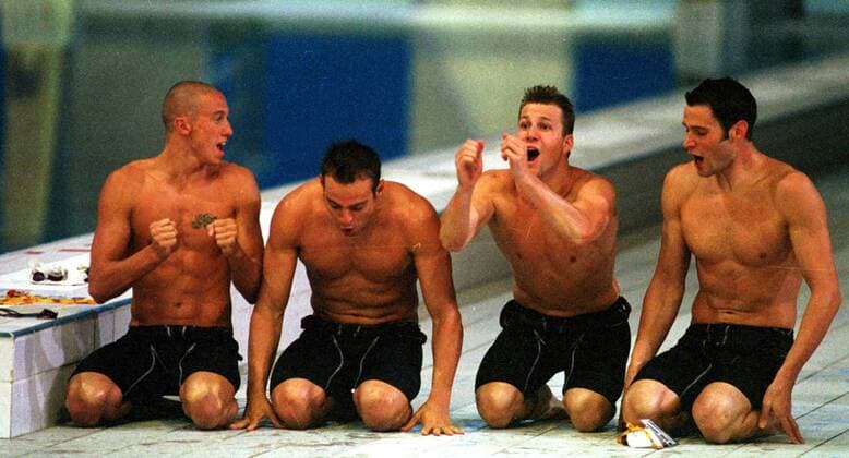The France 4x100m Freestyle relay team celebrate qualification after watching the final heat. Swimming, Sydney Olympics, 16 09 2000. 