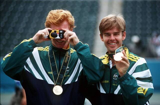 MARK WOODFORDE (LEFT) & TODD WOODBRIDGE (AUSTRALIA) HAVE FUN WITH THE PHOTOGRAPHER AS THEY SHOW OFF THEIR TENNIS DOUBLES GOLD MEDALS. 2 8 1996. ATLANTA OLYMPICS 1996.  o0 Olympiasieg Sieg Goldmedaille Siegerehrung Medal