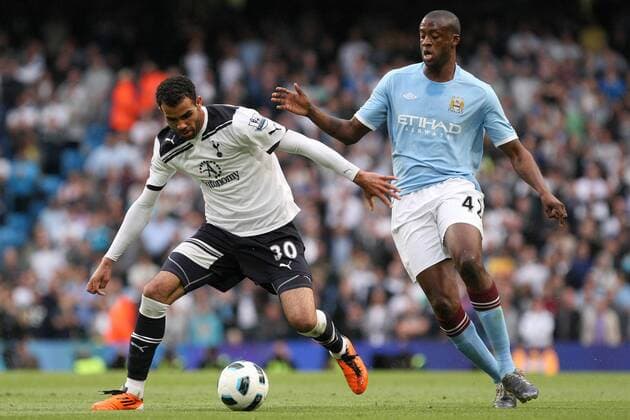 Football - Premier League - Manchester City (blue) vs. Tottenham Hotspur (white): Tottenham s Cordeiro Sandro and Yaya Toure of Manchester City at the City of Manchester Stadium 