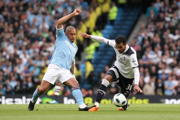 Football - Premier League - Manchester City (blue) vs. Tottenham Hotspur (white): Nigel de Jong of Manchester City challenges Tottenham s Cordeiro Sandro at the City of Manchester Stadium 