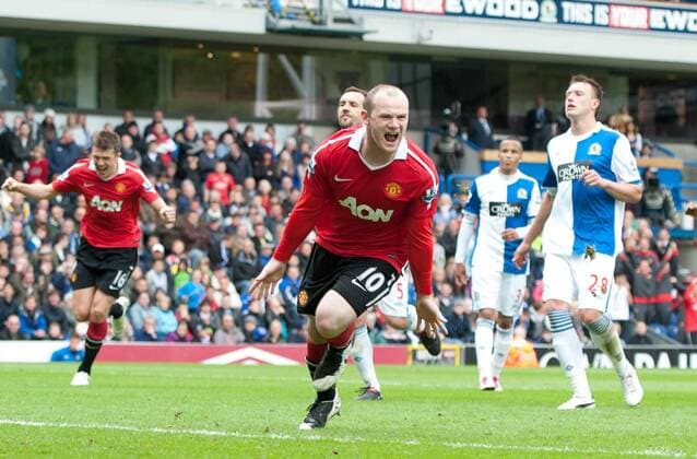 Wayne Rooney of Manchester United (front) celebrates scoring the equalising goal - Premier League - Blackburn Rovers - Manchester United (ManU) - EDITORIAL USE ONLY. No use with unauthorised audio, video, data, fixture lists, club league logos or live services. Online in-match use limited to 120 images, no video emulation. No use in betting, games or single club league player publications.