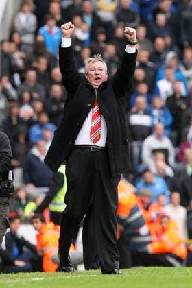 Premier League - Manchester United (ManU) - Alex Ferguson, coach of Manchester United triumphantly punches the air following the referees final whistle at Ewood Park 