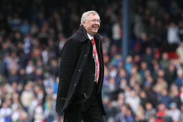 Premier League - Manchester United (ManU) - A delighted Alex Ferguson, coach of Manchester United catches his players up on the pitch at Ewood Park 