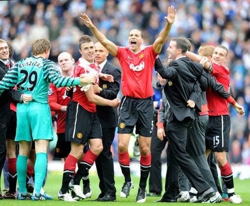 Wayne Rooney of Manchester United (3L), Michael Carrick of Manchester United (4L) and Rio Ferdinand of Manchester United (front) lead the celebrations - Premier League Champion Manchester United (ManU) 2011 in Blackburn - EDITORIAL USE ONLY. No use with unauthorised audio, video, data, fixture lists, club league logos or live services. Online in-match use limited to 120 images, no video emulation. No use in betting, games or single club league player publications.