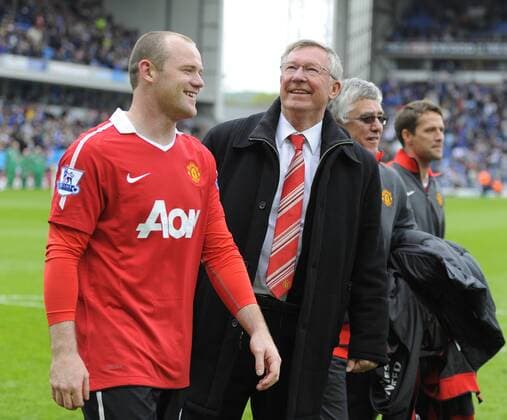 Sir Alex Ferguson coach of Manchester United (R) celebrates with Wayne Rooney of Manchester United - Premier League Champion Manchester United (ManU) 2011 in Blackburn - EDITORIAL USE ONLY. No use with unauthorised audio, video, data, fixture lists, club league logos or live services. Online in-match use limited to 120 images, no video emulation. No use in betting, games or single club league player publications.