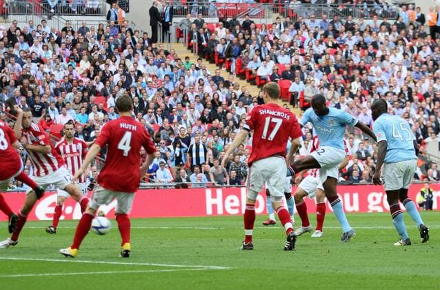Manchester Citys Yaya Toure scoring his sides opening goal -- EON FA Cup Final Manchester City (blue) v Stoke City (red white) 14th May, 2011 EDITORIAL USE ONLY. No use with unauthorised audio, video, data, fixture lists, club league logos or live services. Online in-match use limited to 120 images, no video emulation. No use in betting, games or single club league player publications.