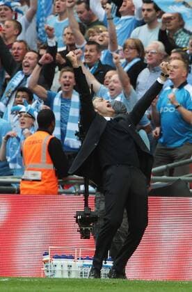 Roberto Manacini coach of Manchester City celebrates winning the Fa Cup -- EON FA Cup Final Manchester City (blue) v Stoke City (red white) 14th May, 2011 EDITORIAL USE ONLY. No use with unauthorised audio, video, data, fixture lists, club league logos or live services. Online in-match use limited to 120 images, no video emulation. No use in betting, games or single club league player publications.