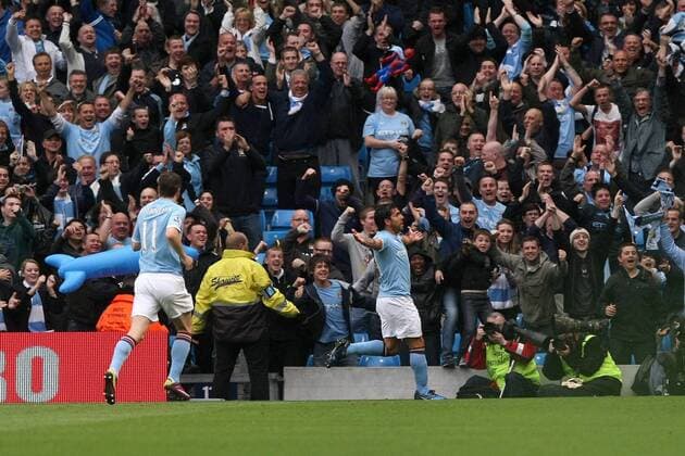 Football - Premier League - Manchester CIty vs. Stoke City Carlos Tevez of Manchester City celebrates his opening goal at the City of Manchester Stadium 
