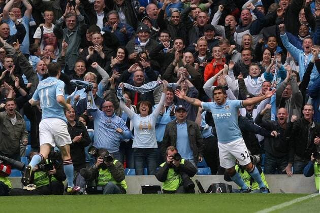 Football - Premier League - Manchester CIty vs. Stoke City Carlos Tevez of Manchester City celebrates his opening goal at the City of Manchester Stadium 