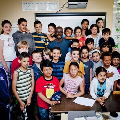 Brussels, Belgium May 25, 2011 Lilian Thuram supports an action against racism with local schoolchildren 