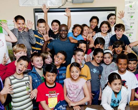 Brussels, Belgium May 25, 2011 Lilian Thuram supports an action against racism with local schoolchildren 
