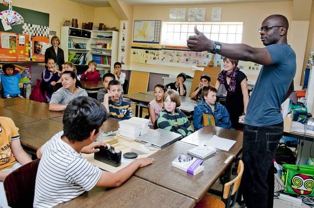 Brussels, Belgium May 25, 2011 Lilian Thuram supports an action against racism with local schoolchildren 