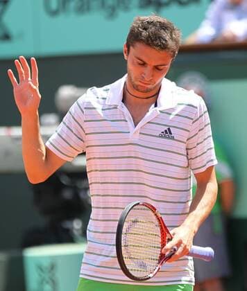 Gilles Simon of France apologizes after winning a point on a net cord during his French Open mens third round match at Roland Garros in Paris on May 28, 2011. Simon defeated Fish 6-3, 6-4, 6-2 to advance to the fourth round.  PAR20110528740
