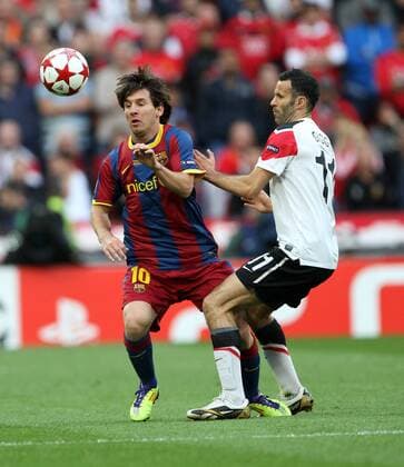 Manchester Uniteds Ryan Giggs tussles with Barcelonas Lionel Messi UEFA Champions League Final Manchester United v Barcelona 28th May, 2011 EDITORIAL USE ONLY. No use with unauthorised audio, video, data, fixture lists, club league logos or live services. Online in-match use limited to 120 images, no video emulation. No use in betting, games or single club league player publications.