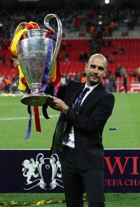 Barcelonas Josep Pep Guardiola celebrates with the trophy UEFA Champions League Final Manchester United v Barcelona 28th May, 2011 EDITORIAL USE ONLY. No use with unauthorised audio, video, data, fixture lists, club league logos or live services. Online in-match use limited to 120 images, no video emulation. No use in betting, games or single club league player publications.