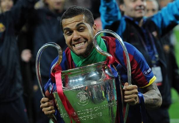 Football - UEFA Champions League Final - Barcelona vs. Manchester United Daniel Alves of Barcelona celebrates with the trophy following his teams win at Wembley Stadium, London  Dani