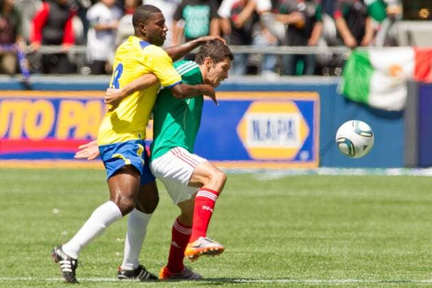 May 28, 2011 - Seattle, Washington, U.S - Ecuador midfielder Edison Mendez (8) holds back Mexico midfielder Israel Castro (8) during the first half at Qwest Field in Seattle, Washington. The game ended in a 1-1 tie. FMF U.S. Tour 2011 - May 28 - Ecuador at Mexico - ZUMAy19