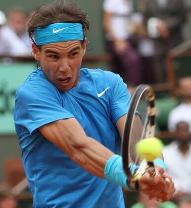 Spaniard Rafael Nadal hits a shot during his French Open mens fourth round matchat Roland Garros in Paris  PAR20110530719