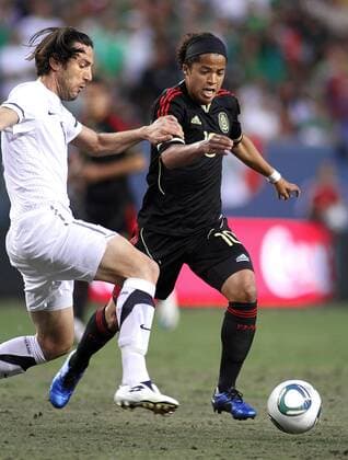 June 1, 2011: 8:17:27 PM - Mexico s Giovani Dos Santos ( 10) tries to beat New Zealand s Ivan Vicelich ( 6) upfield during their friendly as part of the 2011 FMF U.S. Tour at Invesco Field in Denver, Co. Mexico won the match 3-0. Dos Santos had two goals in the victory. SOCCER: JUN 01 Mexico v New Zealand Icon14111060104 EDITORIAL USE ONLY
