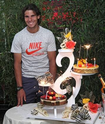 Rafael Nadal (ESP) receives a birthday cake on his 25th birthday after winning his French Open mens semifinal match at Roland Garros in Paris on June 3, 2011.  PAR20110603740