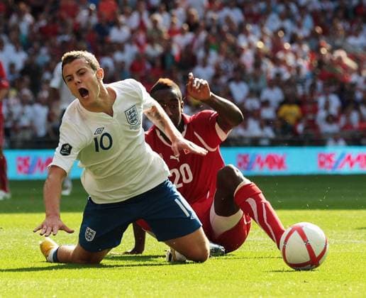 Jack Wilshere of England gets brought down in the penalty area for a penalty by Johan Djourou of Switzerland European Championship Qualifying Group G England v Switzerland 4th June, 2011 EDITORIAL USE ONLY. No use with unauthorised audio, video, data, fixture lists, club league logos or live services. Online in-match use limited to 120 images, no video emulation. No use in betting, games or single club league player publications.