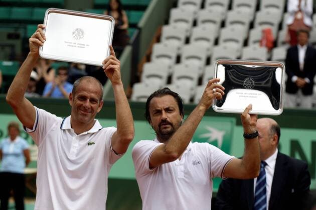 05.06.2011, Paris, France - Guy Forget (FRA) (L) and Henri Leconte (FRA) (R) in the Men s Legends Over 45 final at Roland Garros. Leconte and Forget pick up their trophies xMichaelxCullenx  ActionPlus11179426 Content restricted for UK based newspaper